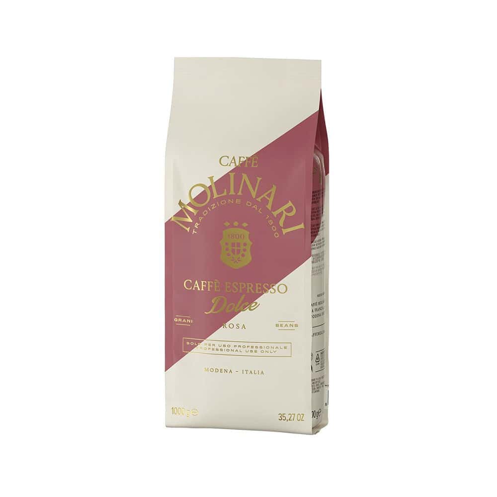 שקית של 1 ק"ג פולי קפה Molinari Dolce Rosa, בעיצוב בצבעי בז' ובורדו עם לוגו Molinari וכיתוב באיטלקית. מושלמים למכונת הקפה שלכם, הפולים הללו מעניקים ארומה עשירה לכוס קפה מושלמת בכל פעם. | אספרסימו